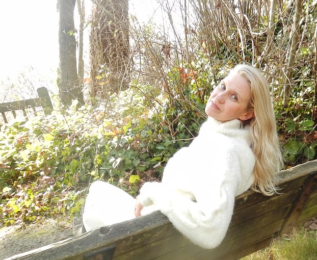 Alexandra McCarthy CEO and Founder of company Siberian Polyprenols pictured in the park on the bench with sunlight all over the scene. This is her while diagnosed with stage IV breast cancer and doing well - a great example of using natural medicines l to heal and restore your health.