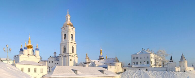 Beautiful Russian Orthodox church near University. All surrounding areas are covered in snow with stark blue sky in the background. You can feel fresh crisp cold air when the image was taken.